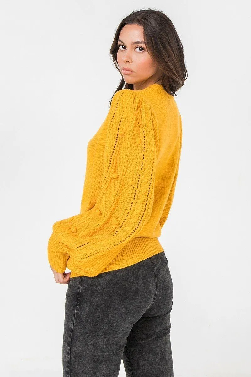 A Sweater Featuring Round Neckline, Puff Sleeves With Wide Cuffs