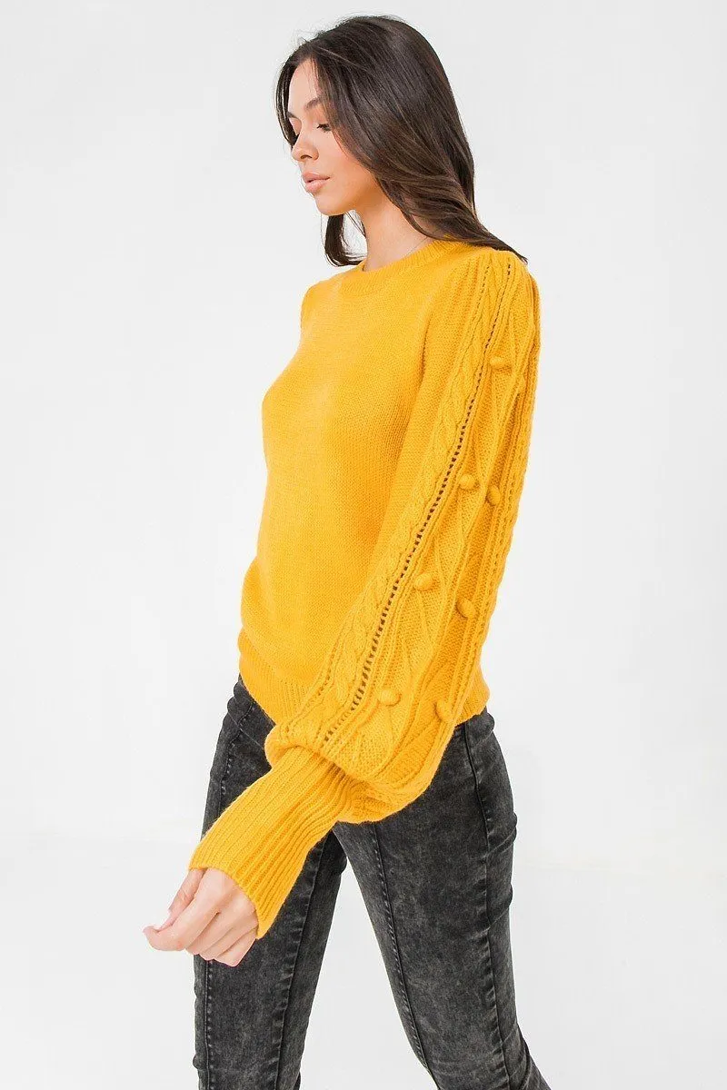 A Sweater Featuring Round Neckline, Puff Sleeves With Wide Cuffs