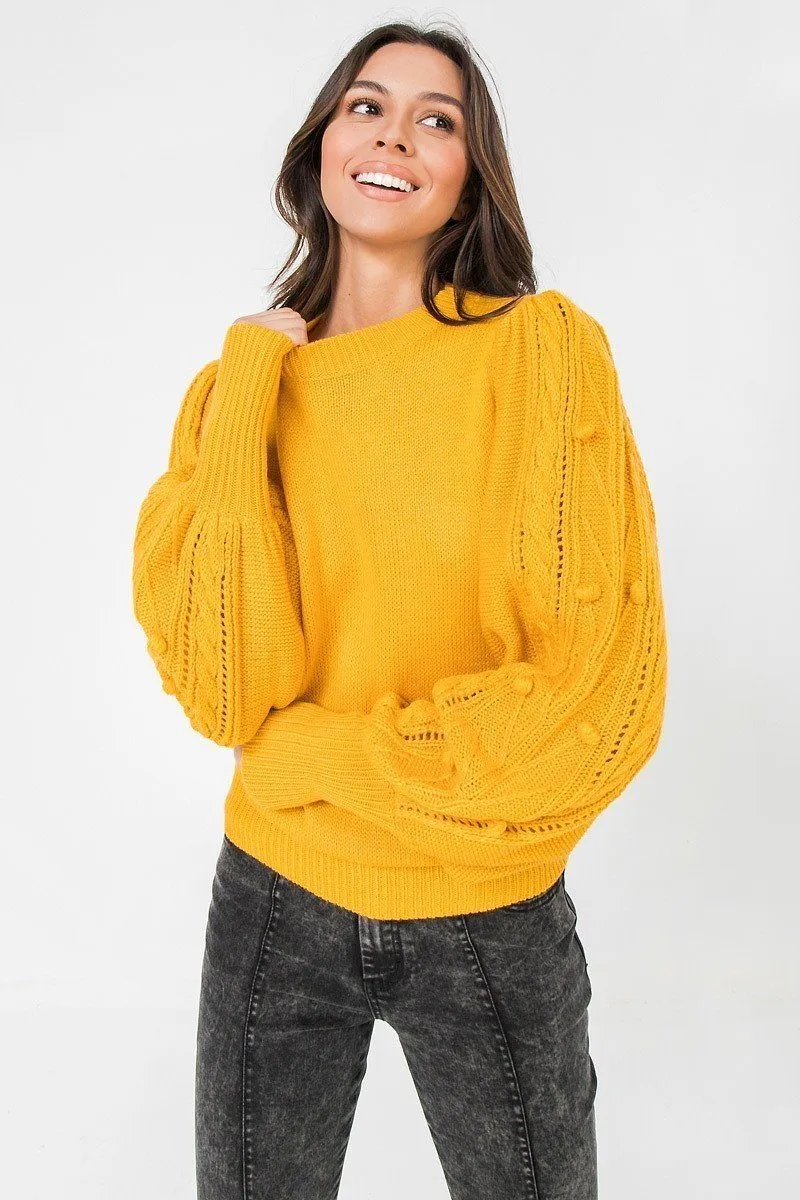 A Sweater Featuring Round Neckline, Puff Sleeves With Wide Cuffs