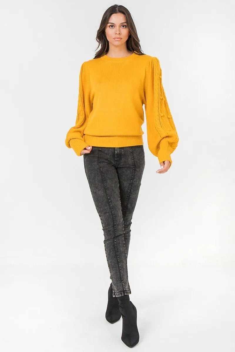 A Sweater Featuring Round Neckline, Puff Sleeves With Wide Cuffs