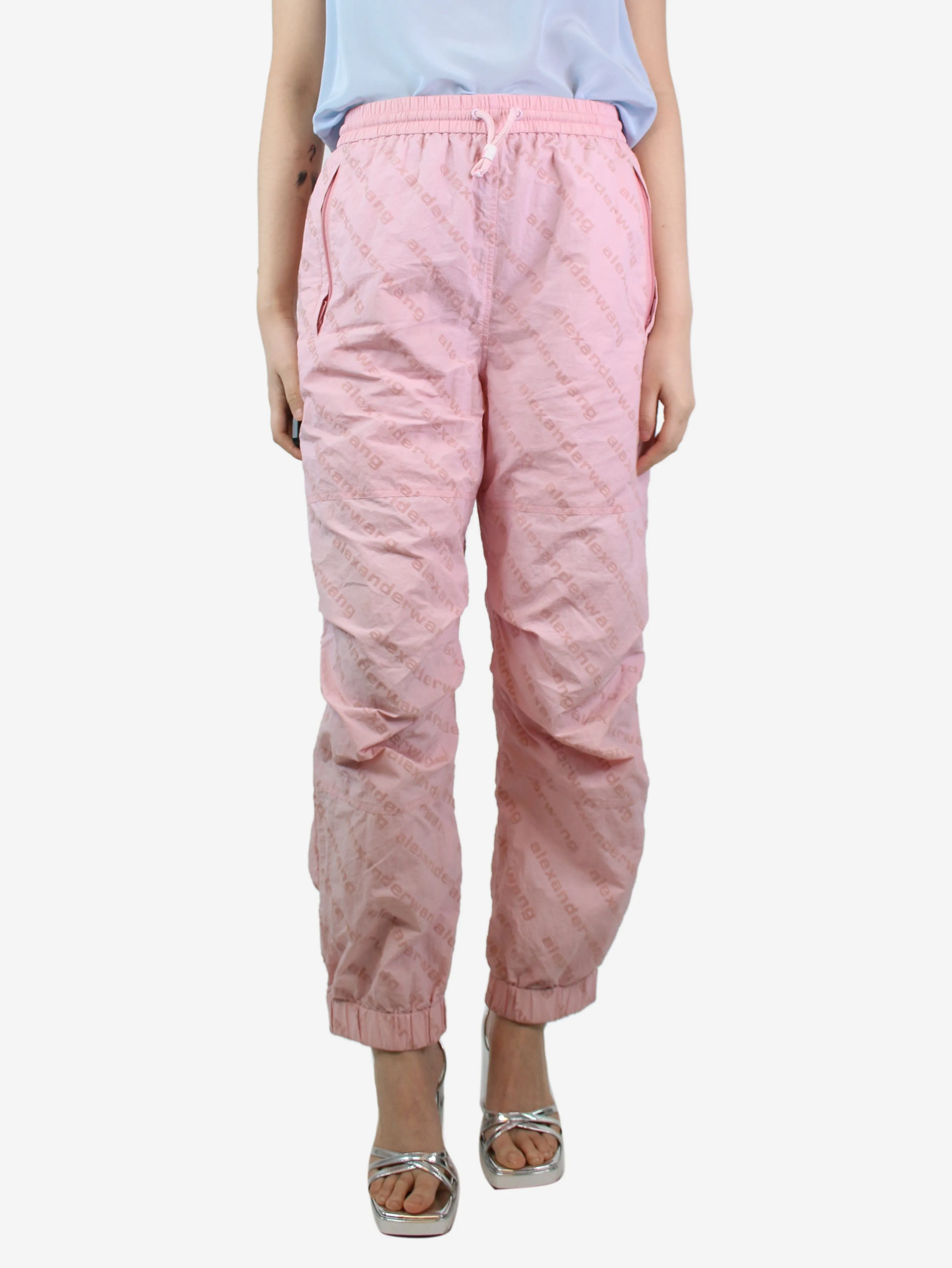 Light pink all-over flocked logo trousers - size M